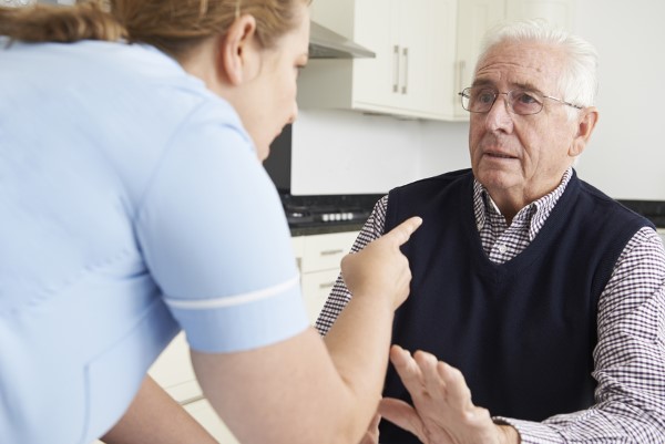 Care Worker Mistreating Elderly Man nursing home abuse insurance